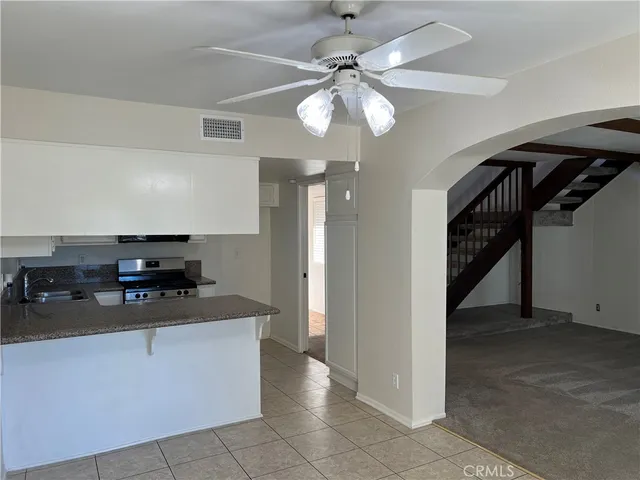 a kitchen with a cabinets and chandelier