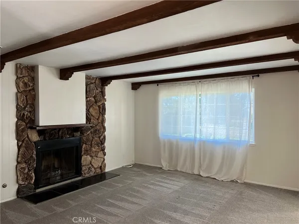 a view of a livingroom with a fireplace