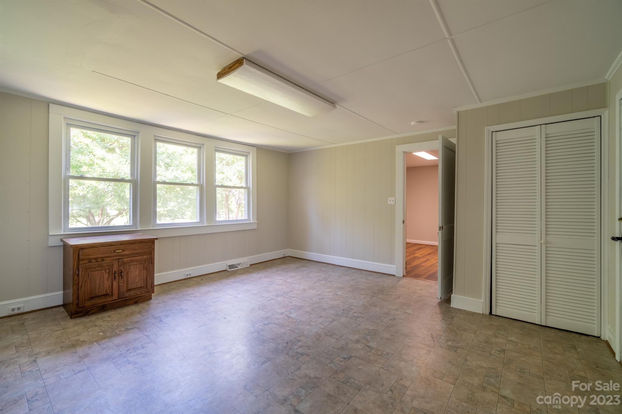 17158 Pond Road Locust, NC 28097 - Photo 11 of 28 an empty room with windows and closet