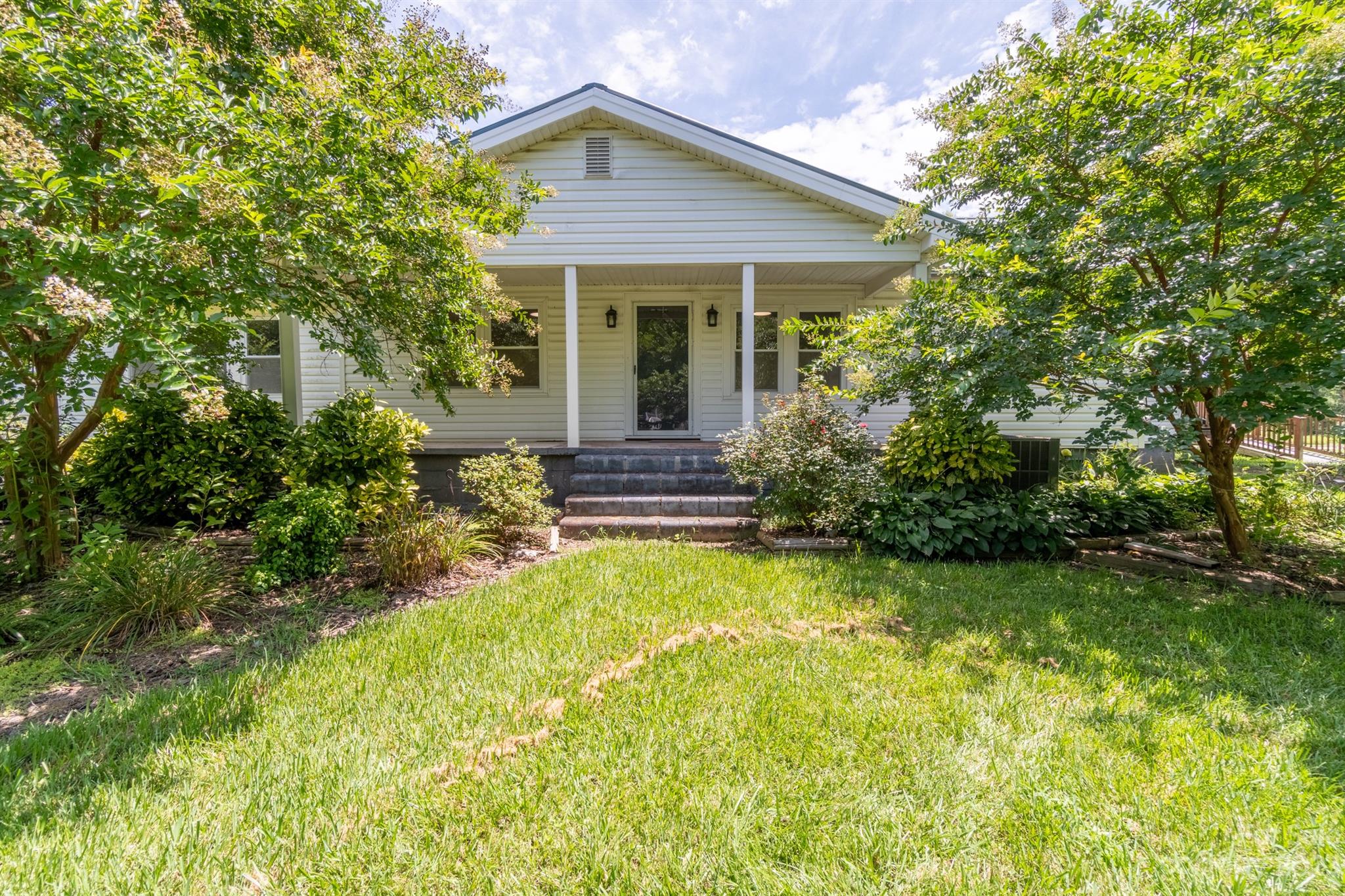 17158 Pond Road Locust, NC 28097 - Photo 2 of 28 a front view of house with yard and green space