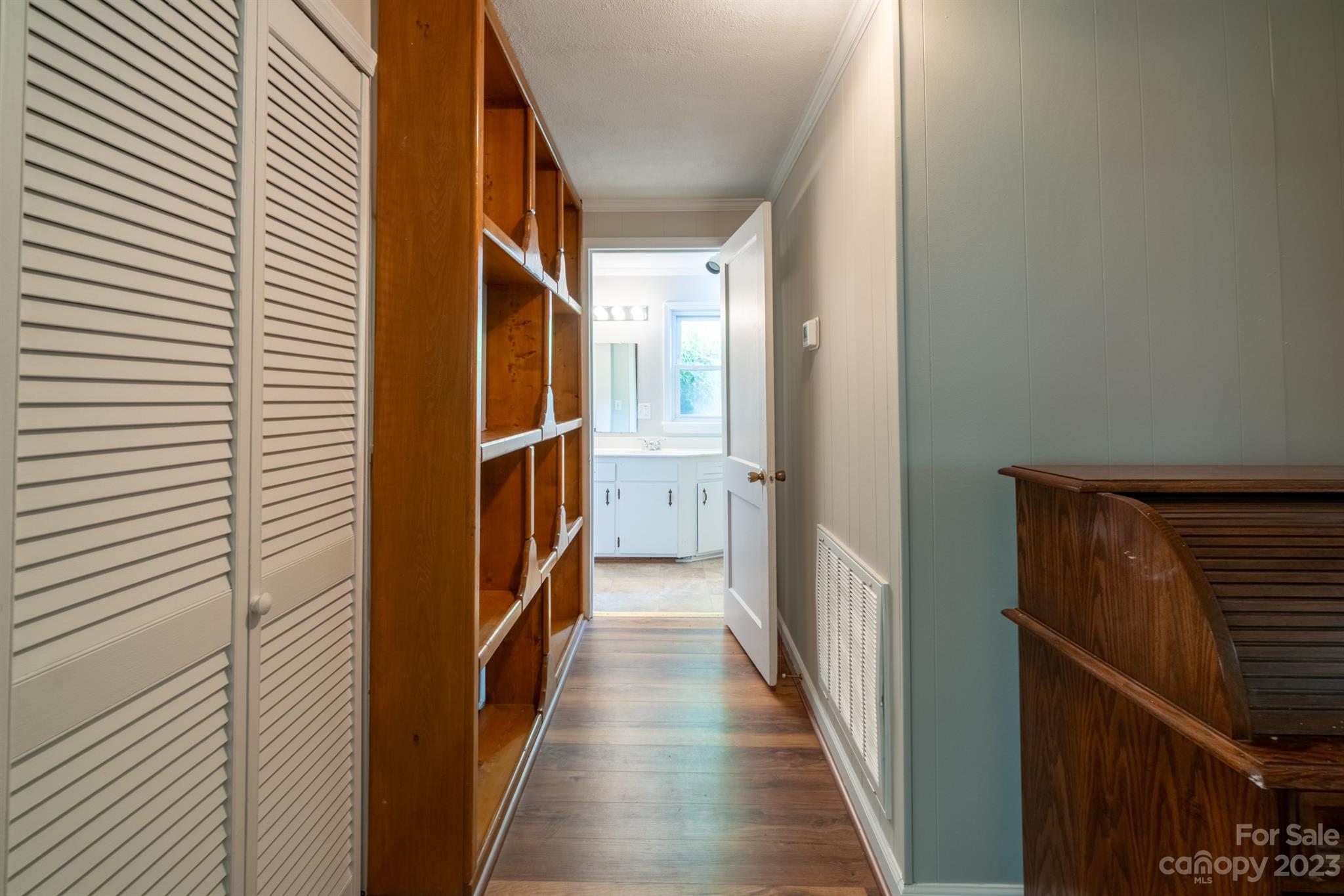 17158 Pond Road Locust, NC 28097 - Photo 23 of 28 a view of a hallway with wooden floor and staircase