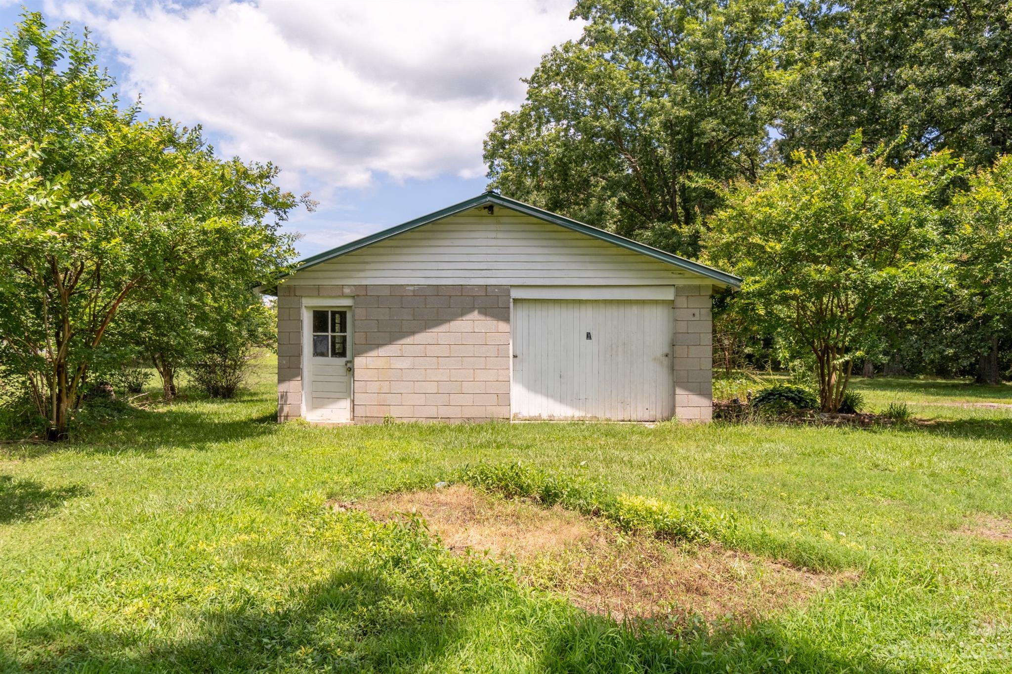 17158 Pond Road Locust, NC 28097 - Photo 26 of 28 a front view of house with yard and trees