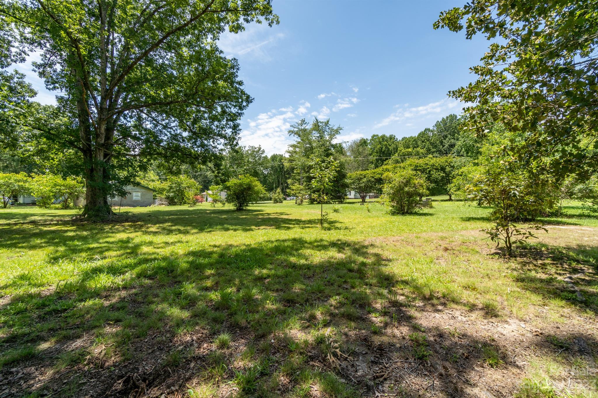 17158 Pond Road Locust, NC 28097 - Photo 27 of 28 a large yard with lots of green space and trees all around
