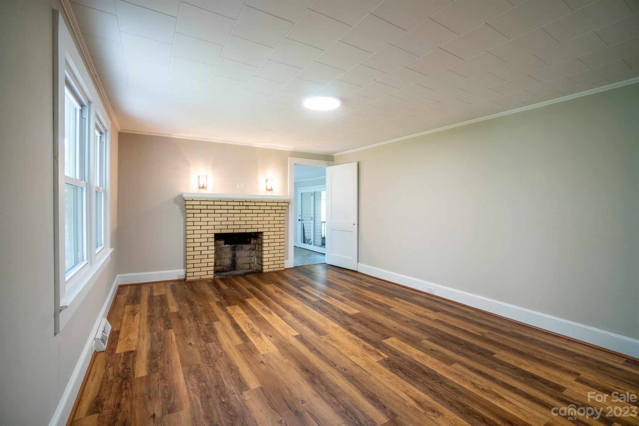 17158 Pond Road Locust, NC 28097 - Photo 4 of 28 a view of an empty room with a fireplace and a window