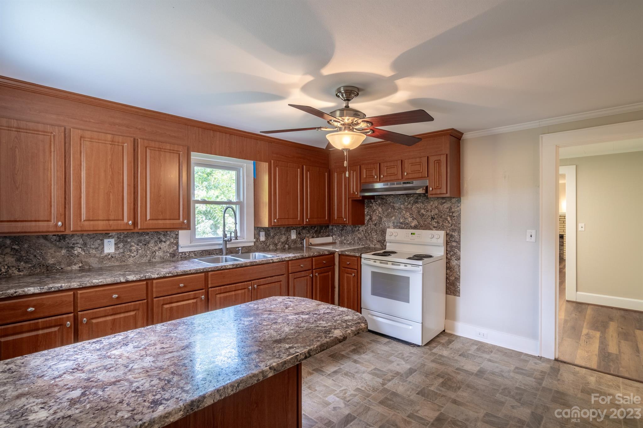 17158 Pond Road Locust, NC 28097 - Photo 9 of 28 a kitchen with stainless steel appliances granite countertop a stove and a sink