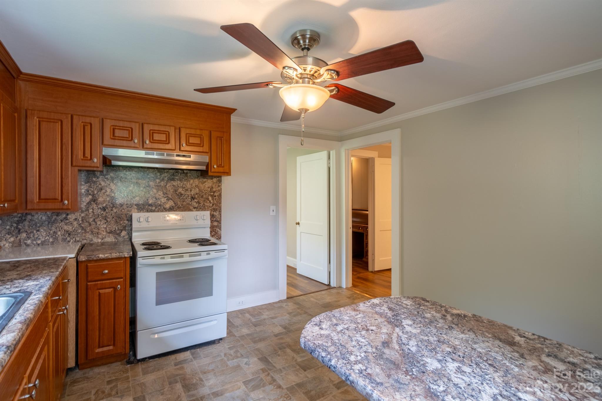 17158 Pond Road Locust, NC 28097 - Photo 10 of 28 a kitchen with stainless steel appliances granite countertop a stove and a refrigerator