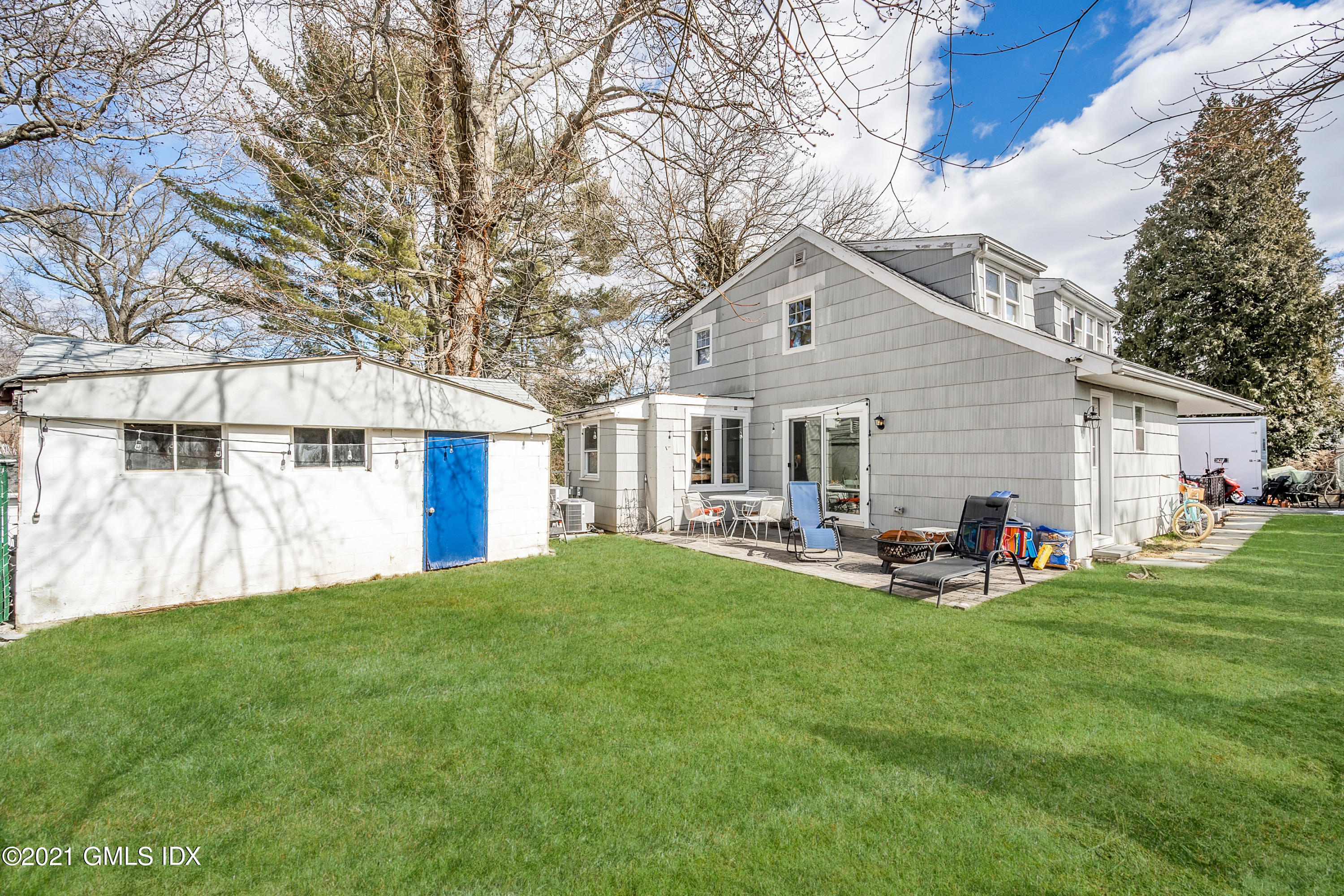 33 Sunshine Avenue Riverside, CT 06878 - Photo 15 of 18 a front view of house with yard and seating area