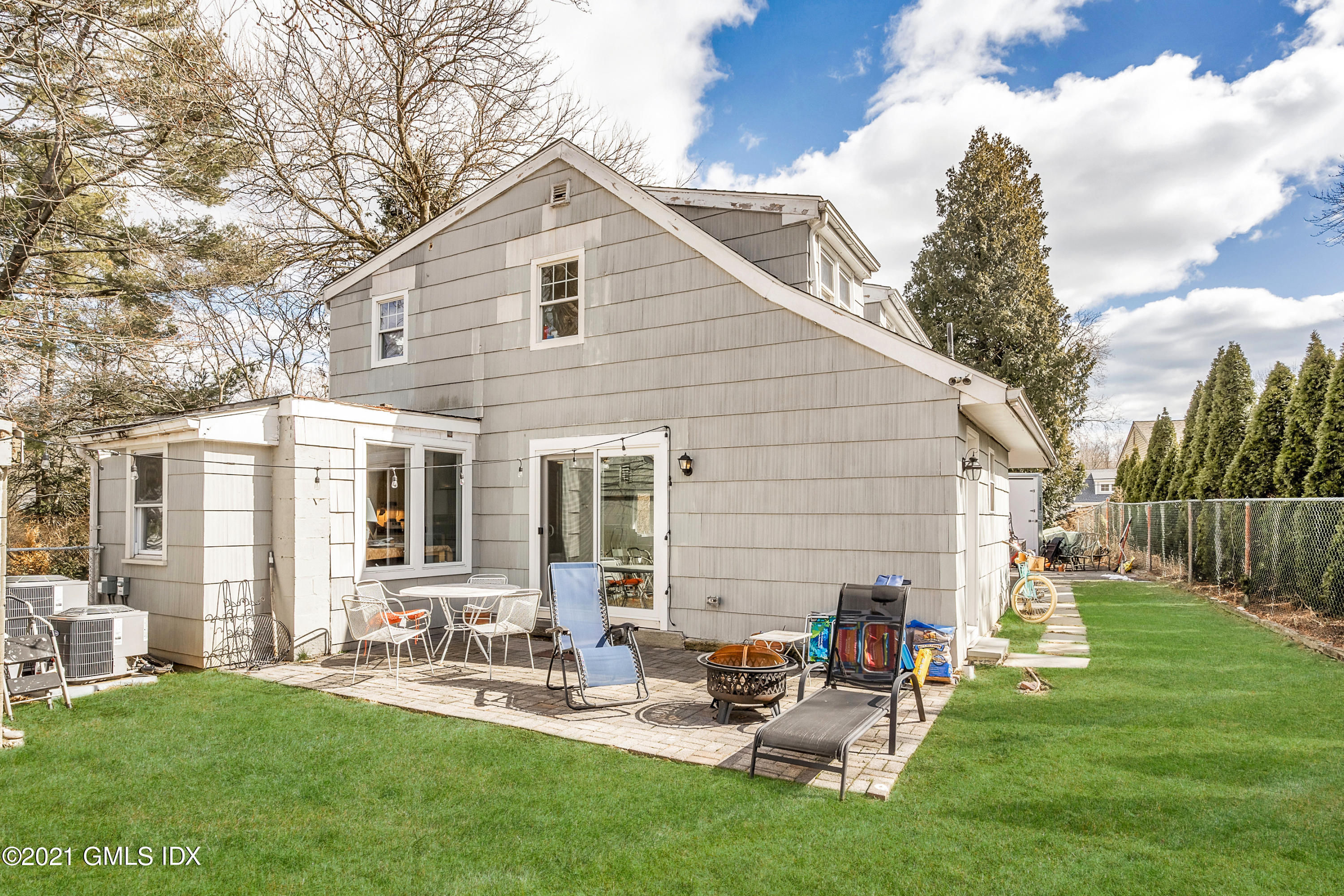 33 Sunshine Avenue Riverside, CT 06878 - Photo 16 of 18 a backyard of a house with outdoor seating