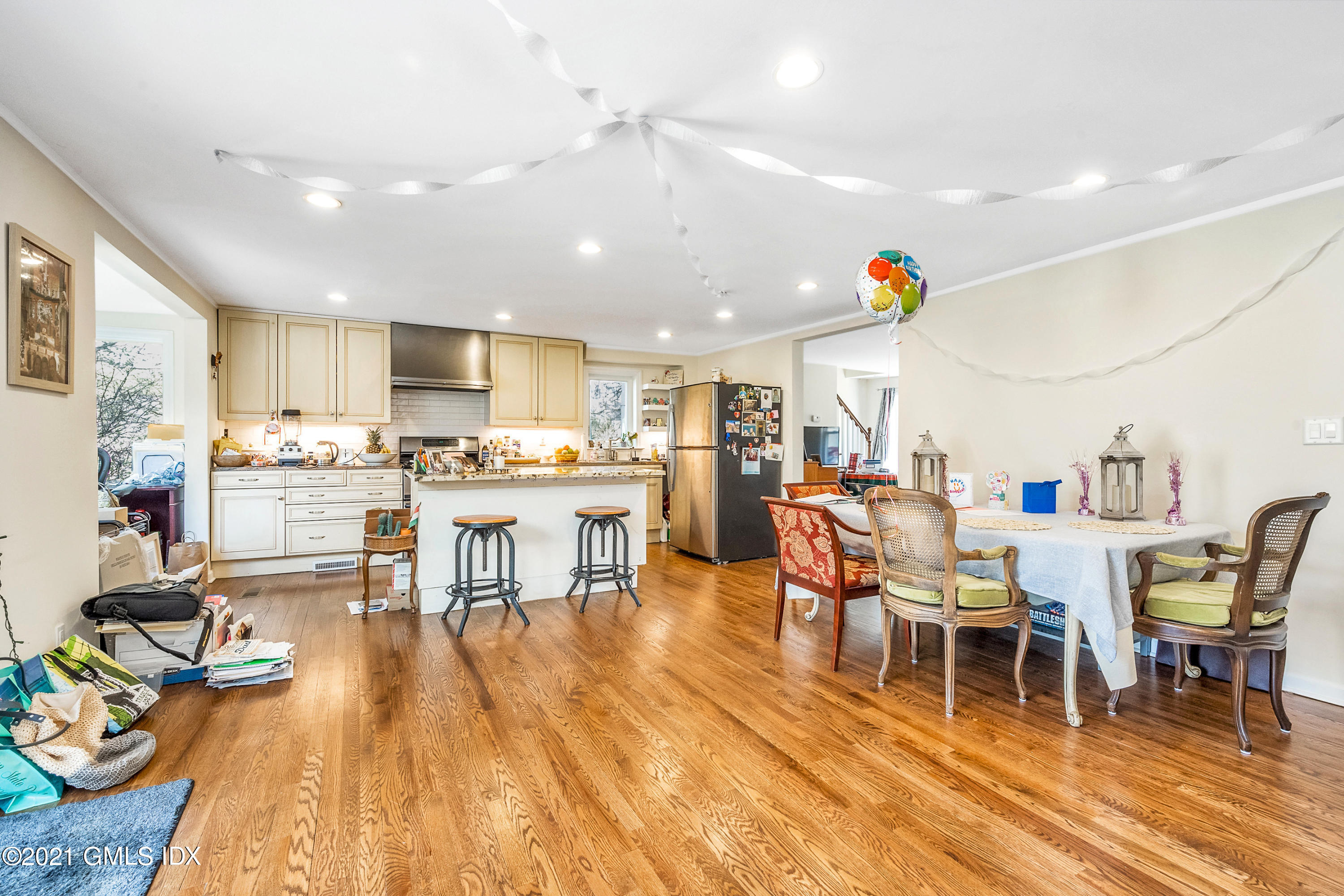 33 Sunshine Avenue Riverside, CT 06878 - Photo 6 of 18 a living room with lots of furniture and kitchen view