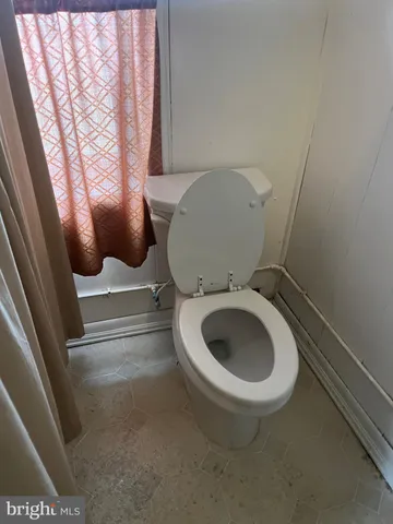 a bathroom with a toilet and a sink