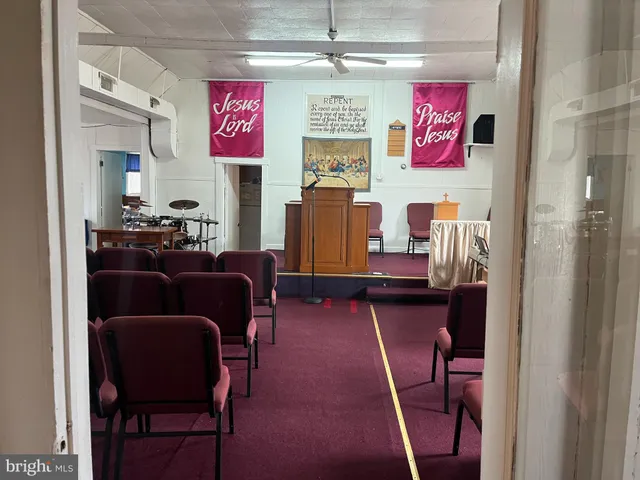 a room with furniture and a bookshelf