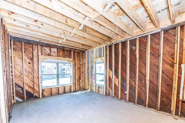 a view of an empty room with wooden walls