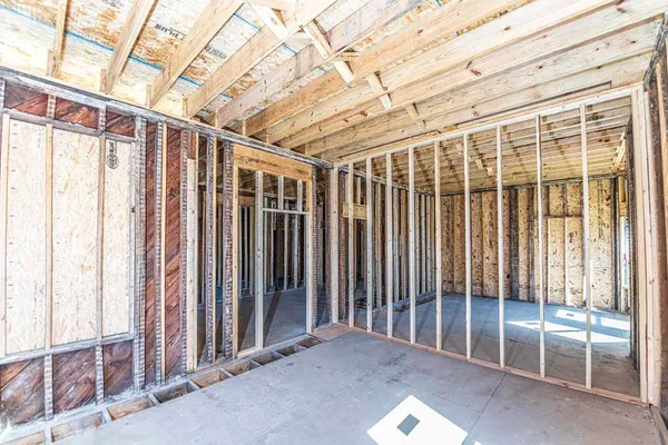 a view of a hallway with wooden walls and entryway