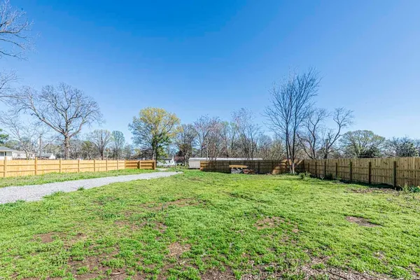 a view of empty room with floor to ceiling windows