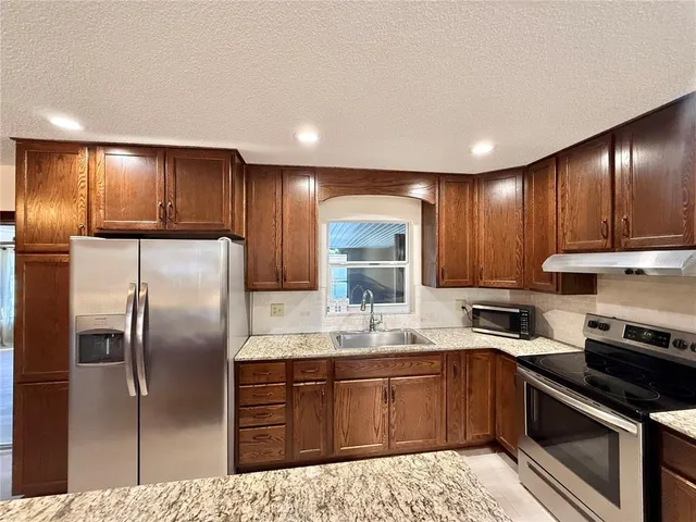 a view of room with window and wooden floor