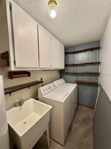 a view of a backyard with sitting area