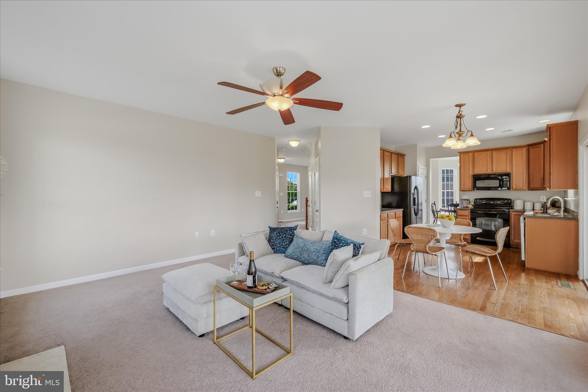 41 Weese Point Shepherdstown, WV 25443 - Photo 20 of 54 a living room with furniture a kitchen view and a chandelier