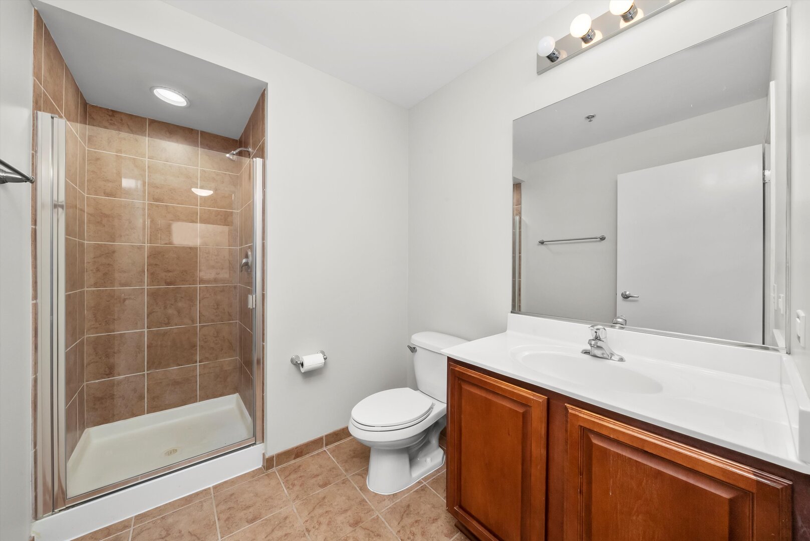 1255 South State Street, Unit 1702 Chicago, IL 60605 - Photo 32 of 36 a bathroom with a toilet sink and shower