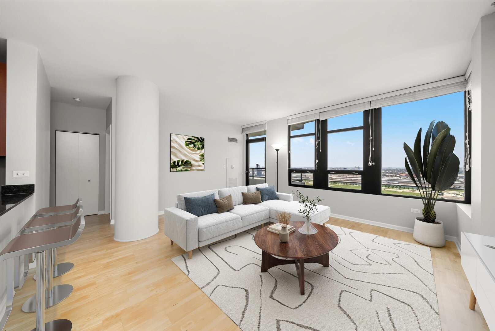 1255 South State Street, Unit 1702 Chicago, IL 60605 - Photo 10 of 36 a living room with furniture and a large window