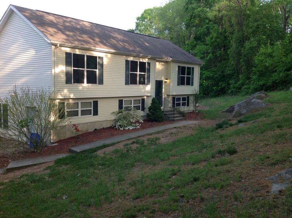 63 Lathrop Road Quaker Hill, CT 06375 - Photo 1 of 1 a view of a yard in front of house