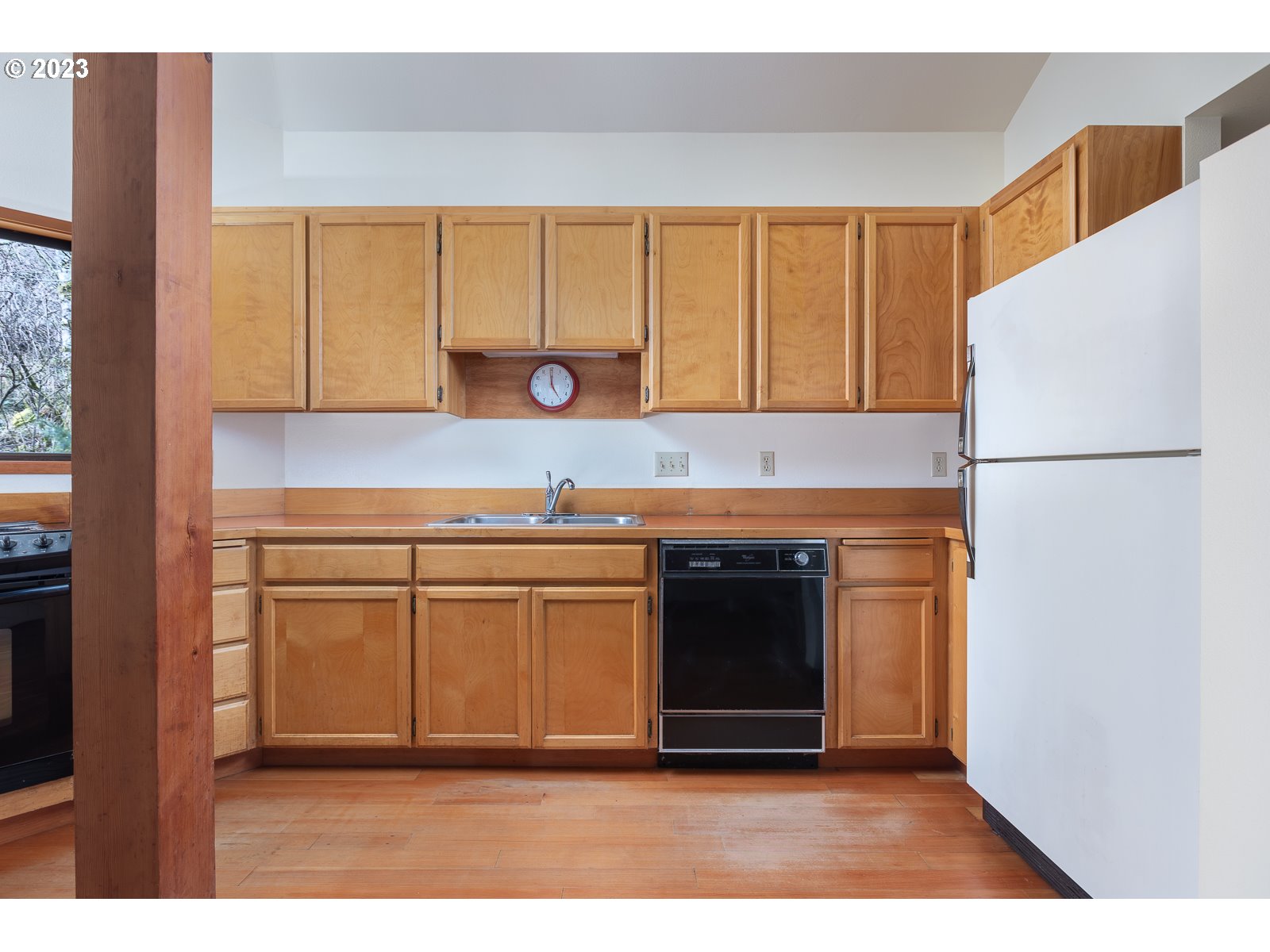 2170 Old Ranch Road Otis, OR 97368 - Photo 11 of 32 a kitchen with a refrigerator and a sink
