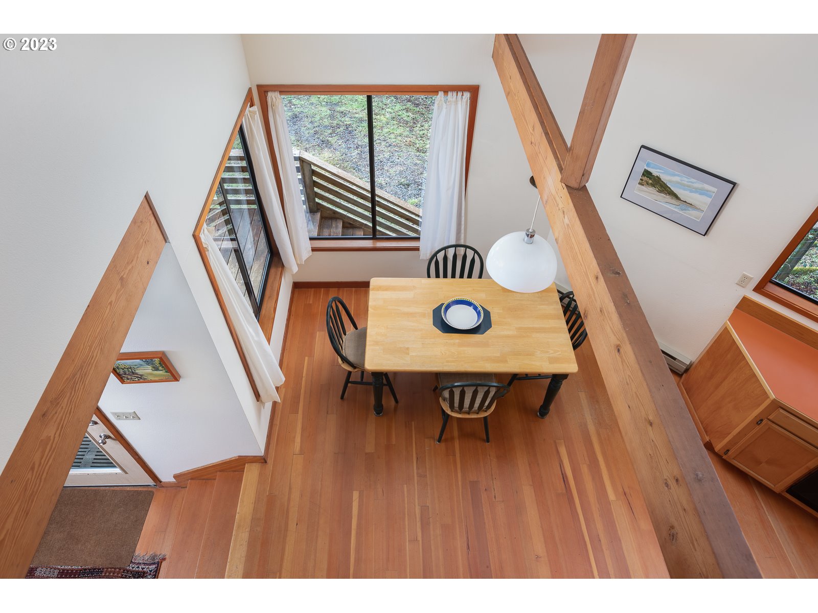2170 Old Ranch Road Otis, OR 97368 - Photo 13 of 32 a view of a hallway with wooden floor and white walls
