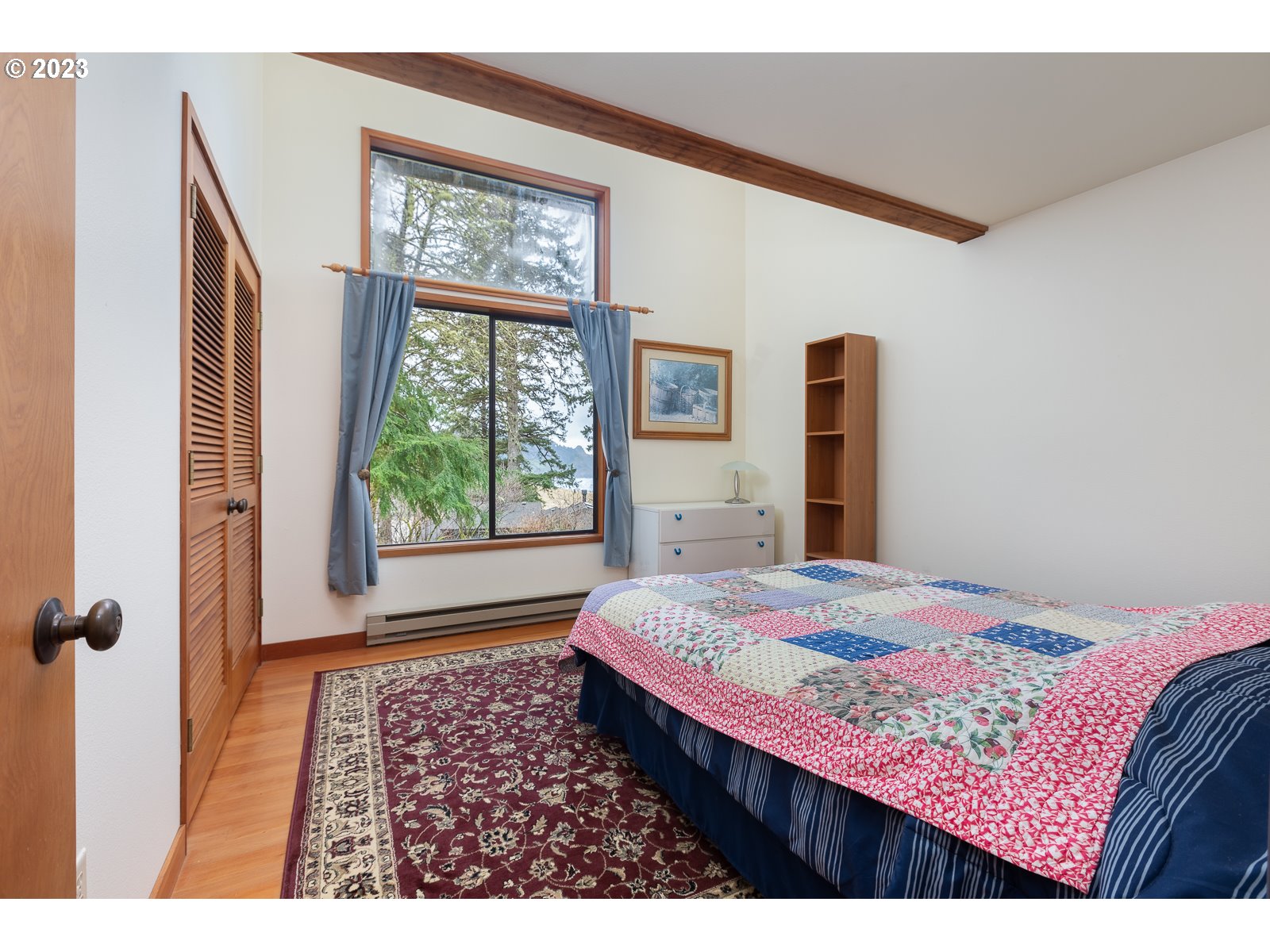 2170 Old Ranch Road Otis, OR 97368 - Photo 14 of 32 a bedroom with a bed and a window