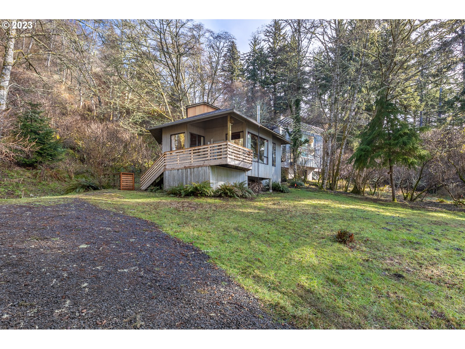 2170 Old Ranch Road Otis, OR 97368 - Photo 2 of 32 a front view of a house with a yard