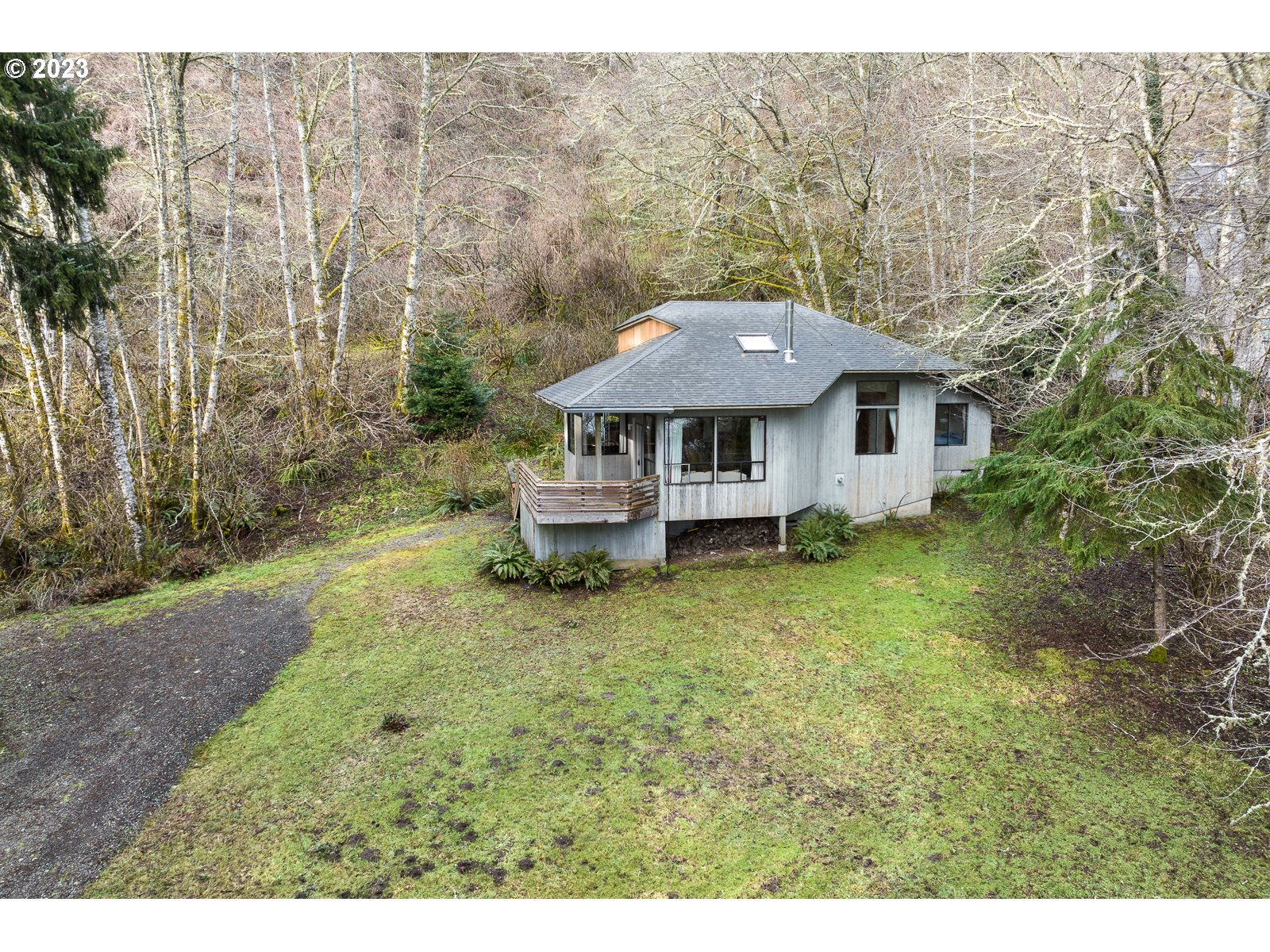 2170 Old Ranch Road Otis, OR 97368 - Photo 29 of 32 a front view of a house with a yard