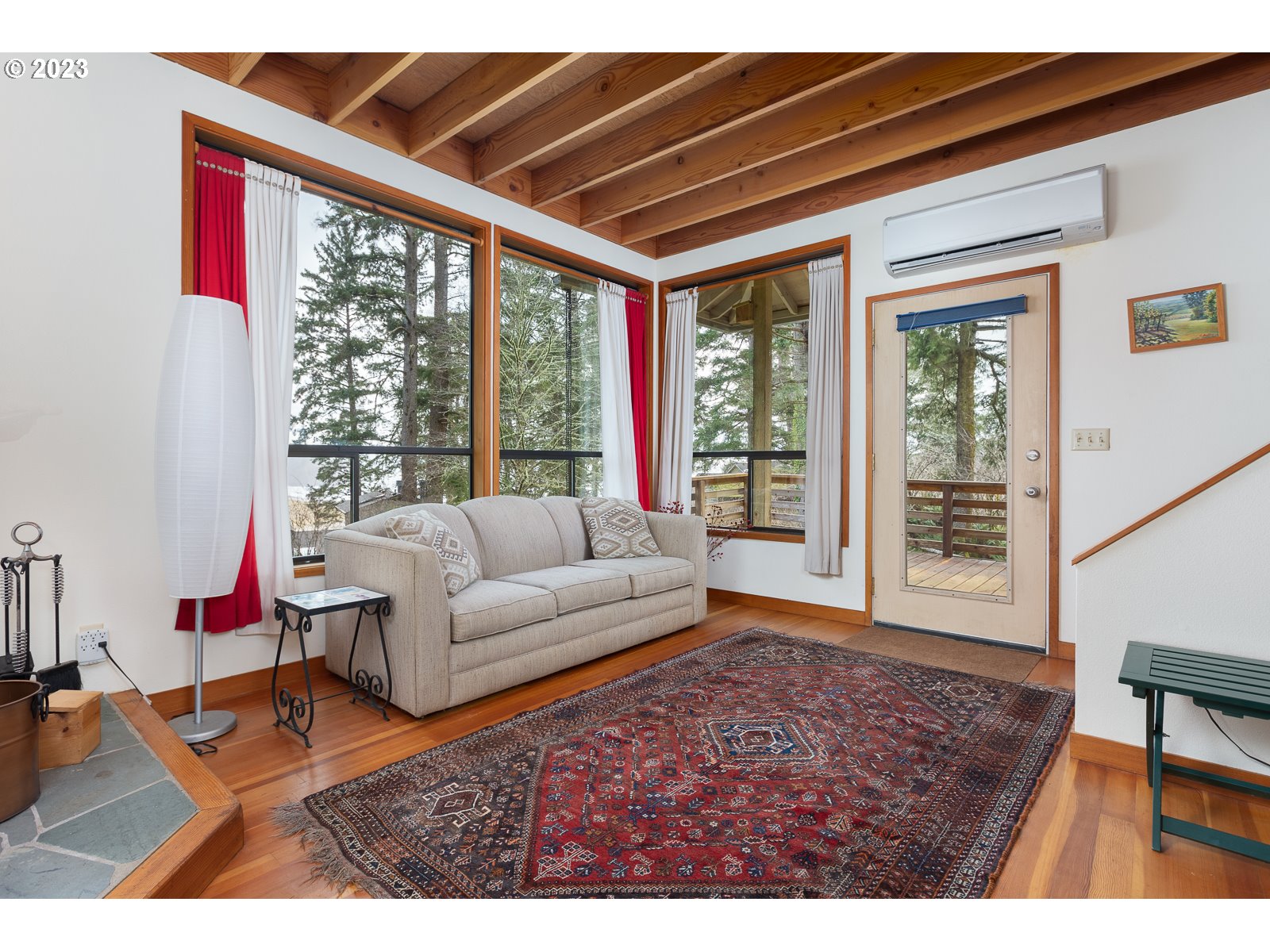 2170 Old Ranch Road Otis, OR 97368 - Photo 5 of 32 a living room with furniture and a large window