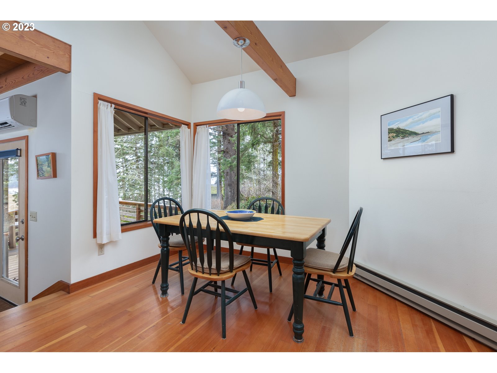 2170 Old Ranch Road Otis, OR 97368 - Photo 8 of 32 a view of a dining room with furniture window and wooden floor