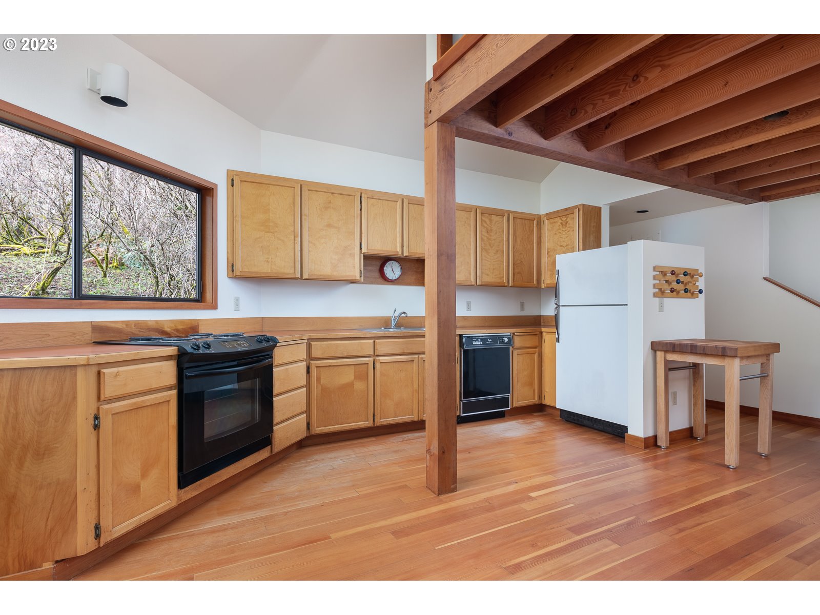2170 Old Ranch Road Otis, OR 97368 - Photo 9 of 32 a kitchen with a stove a sink and a refrigerator