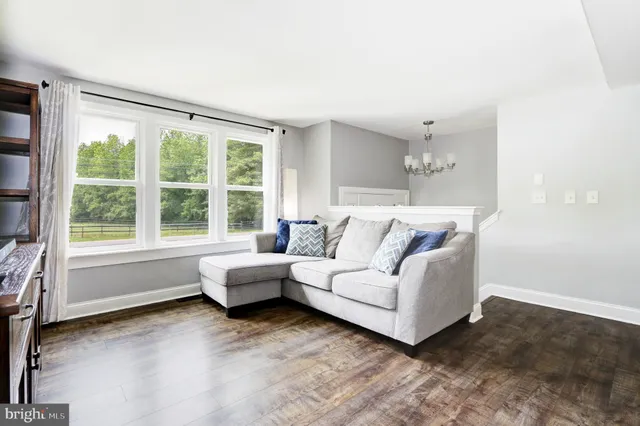 a living room with furniture and windows