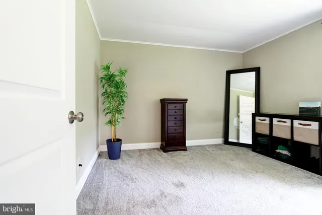 a view of an empty room and a window