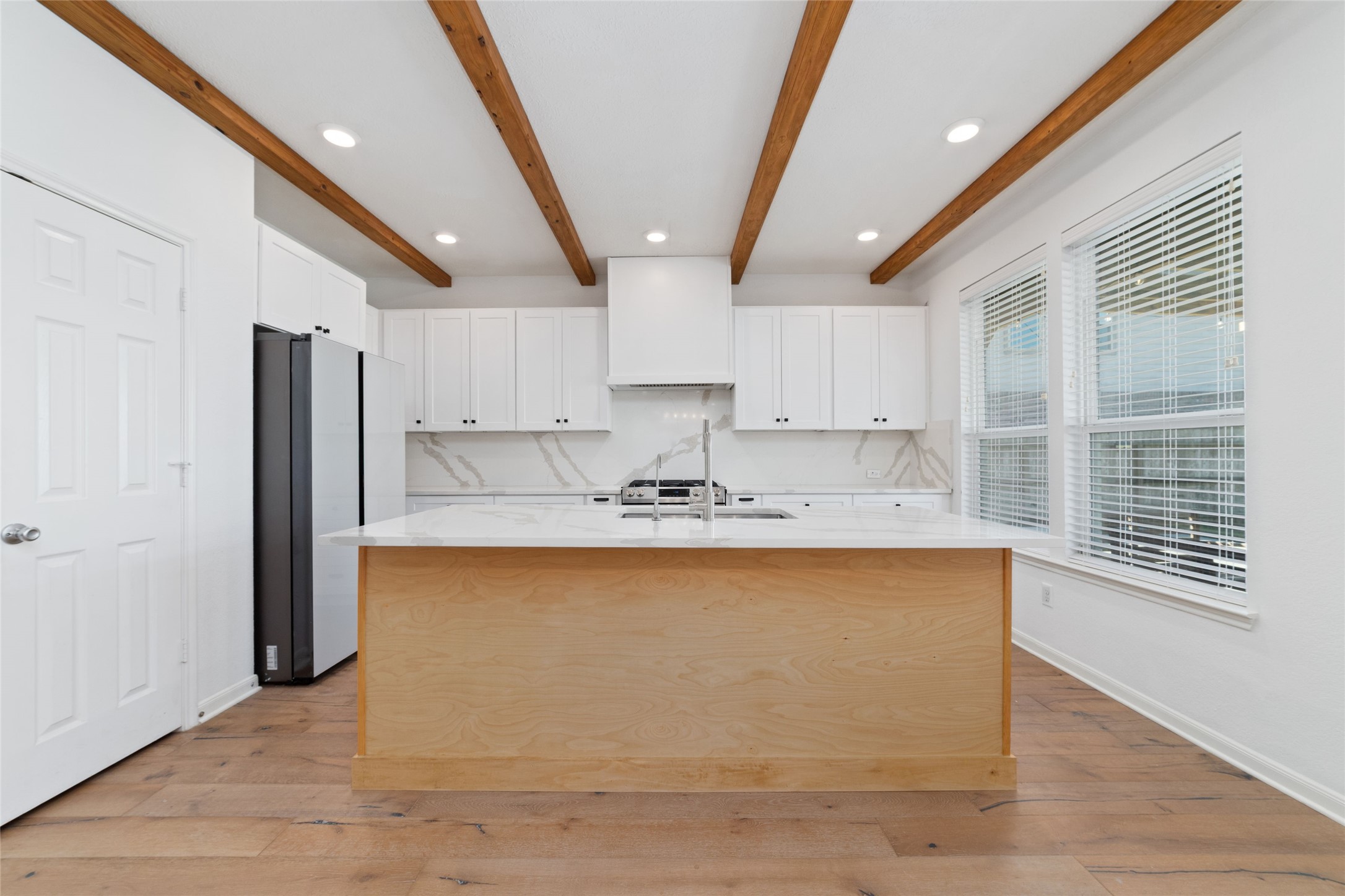 3508 Saxton Green Road Pearland, TX 77584 - Photo 11 of 45 a kitchen with stainless steel appliances granite countertop a sink a stove a refrigerator and cabinets
