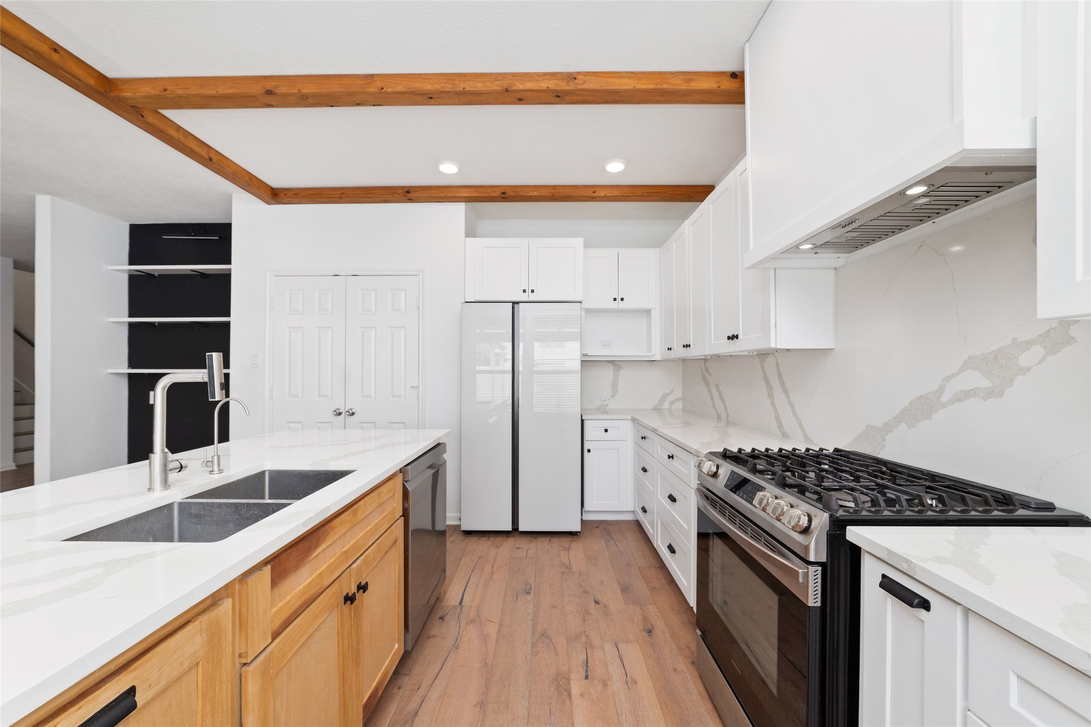 3508 Saxton Green Road Pearland, TX 77584 - Photo 12 of 45 a kitchen with a sink stove and cabinets