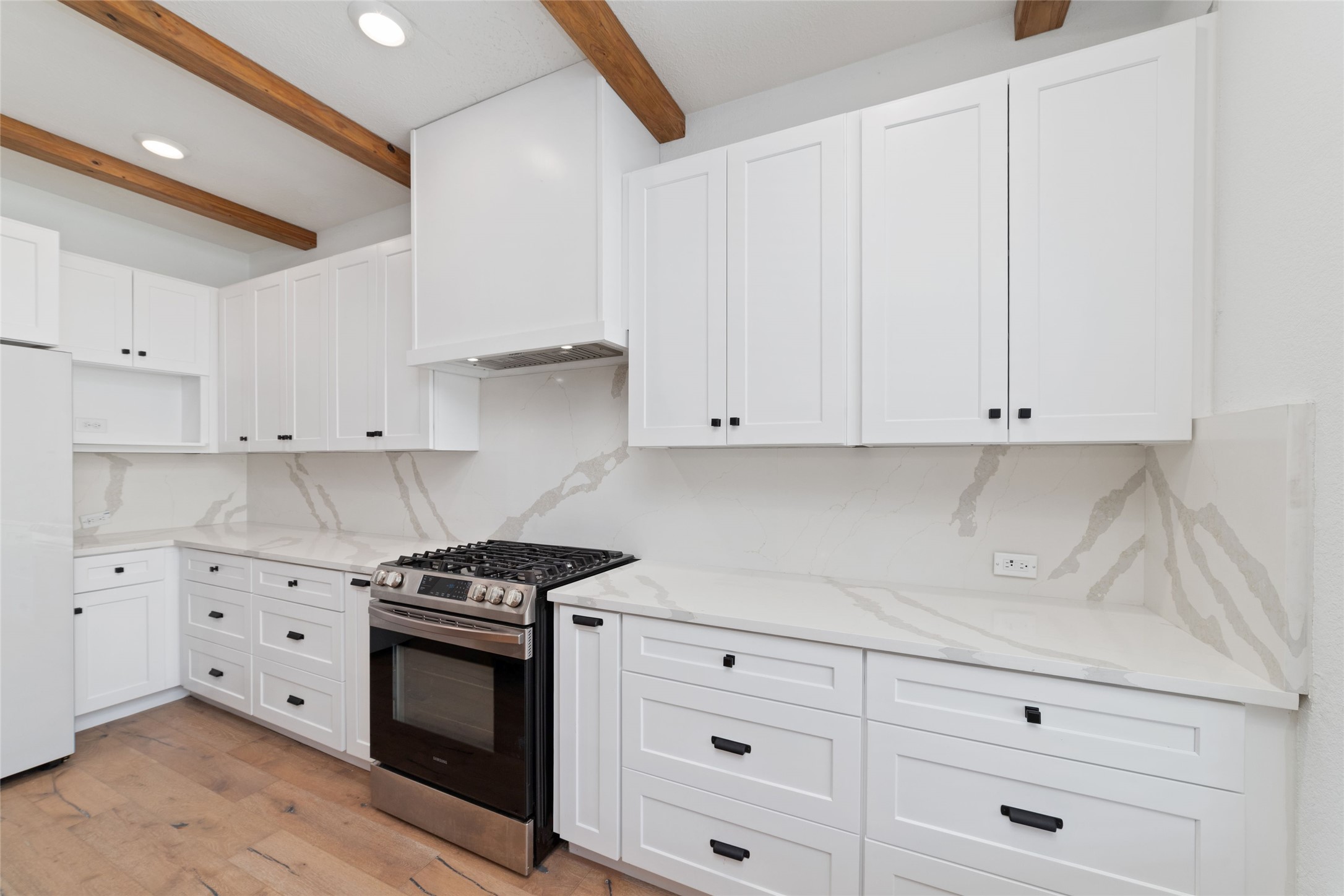 3508 Saxton Green Road Pearland, TX 77584 - Photo 13 of 45 a kitchen with granite countertop white cabinets and white appliances