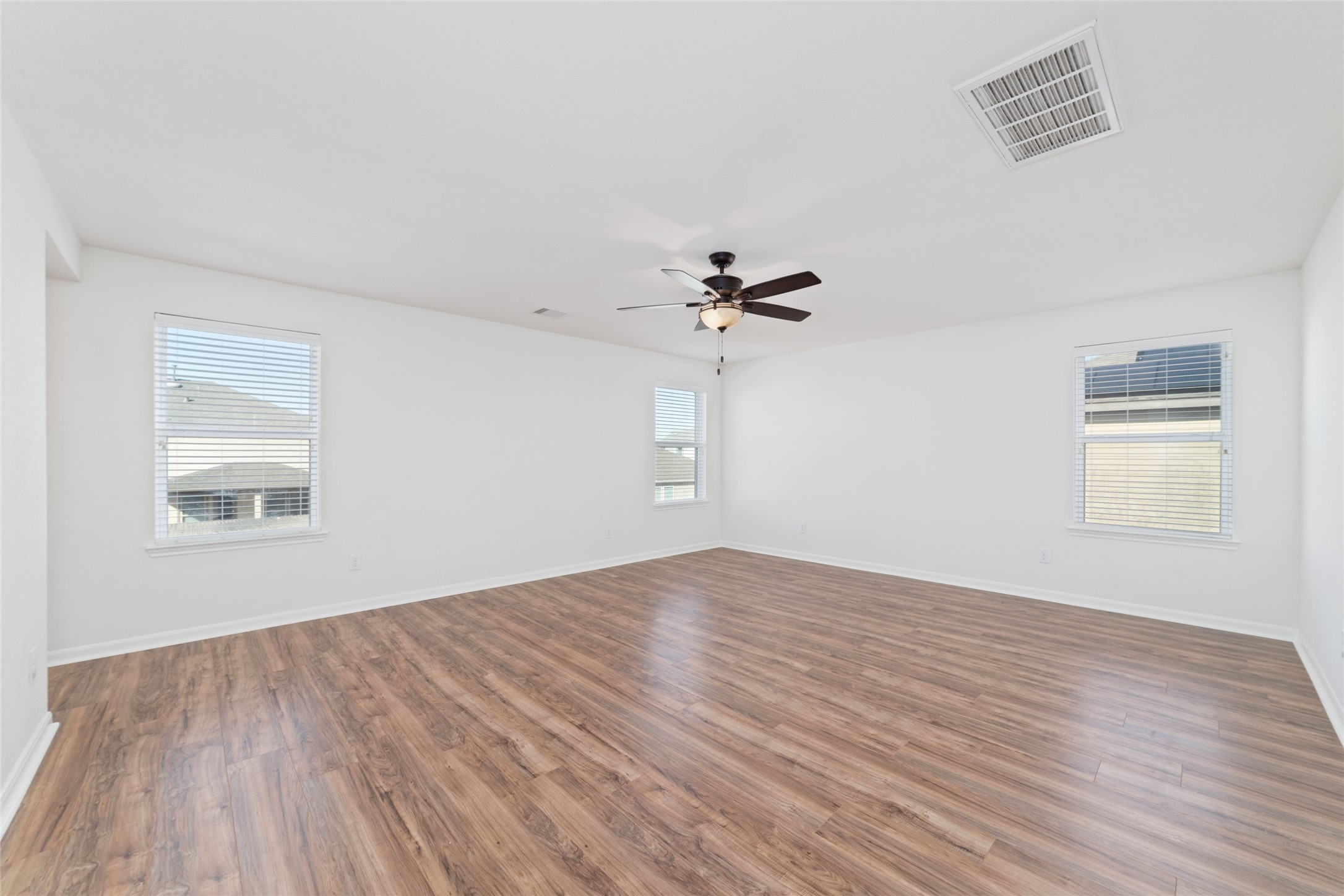 3508 Saxton Green Road Pearland, TX 77584 - Photo 16 of 45 a view of empty room with wooden floor and fan