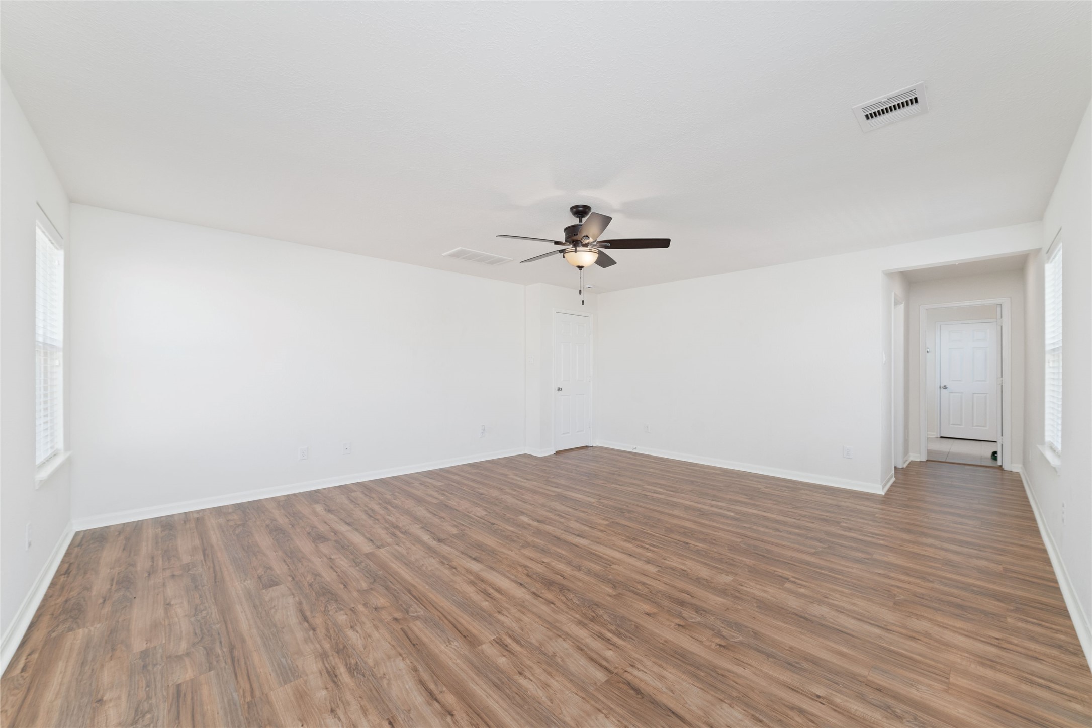 3508 Saxton Green Road Pearland, TX 77584 - Photo 17 of 45 a view of empty room with wooden floor