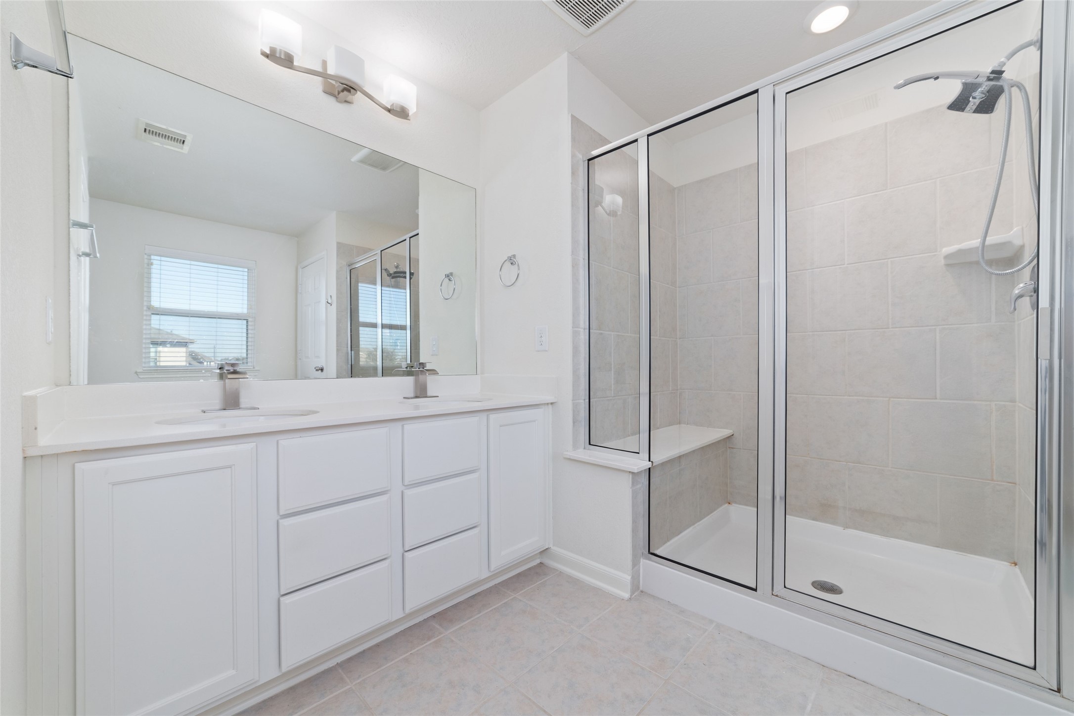 3508 Saxton Green Road Pearland, TX 77584 - Photo 19 of 45 a bathroom with a shower sink and mirror