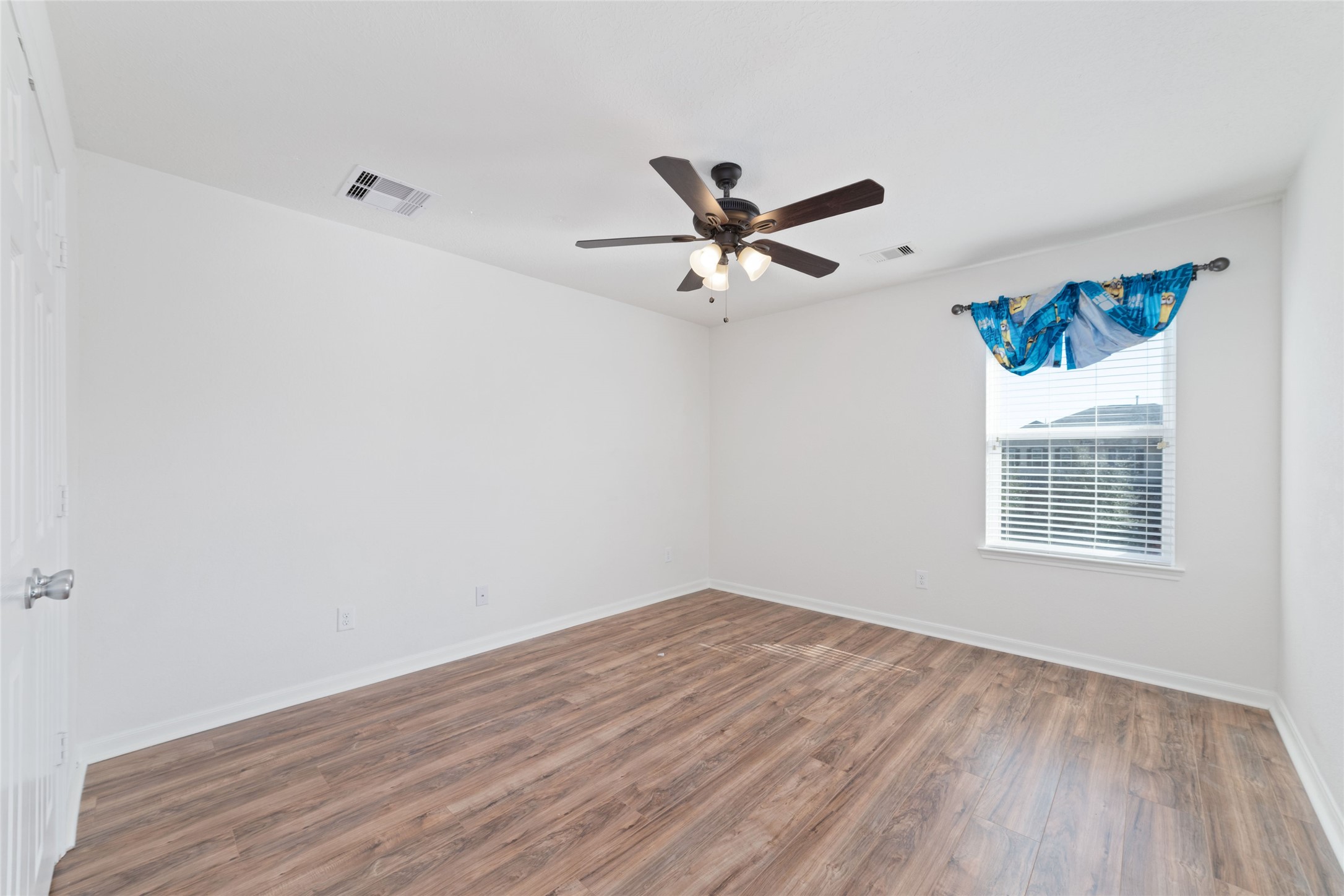 3508 Saxton Green Road Pearland, TX 77584 - Photo 23 of 45 a view of a big room with wooden floor and windows