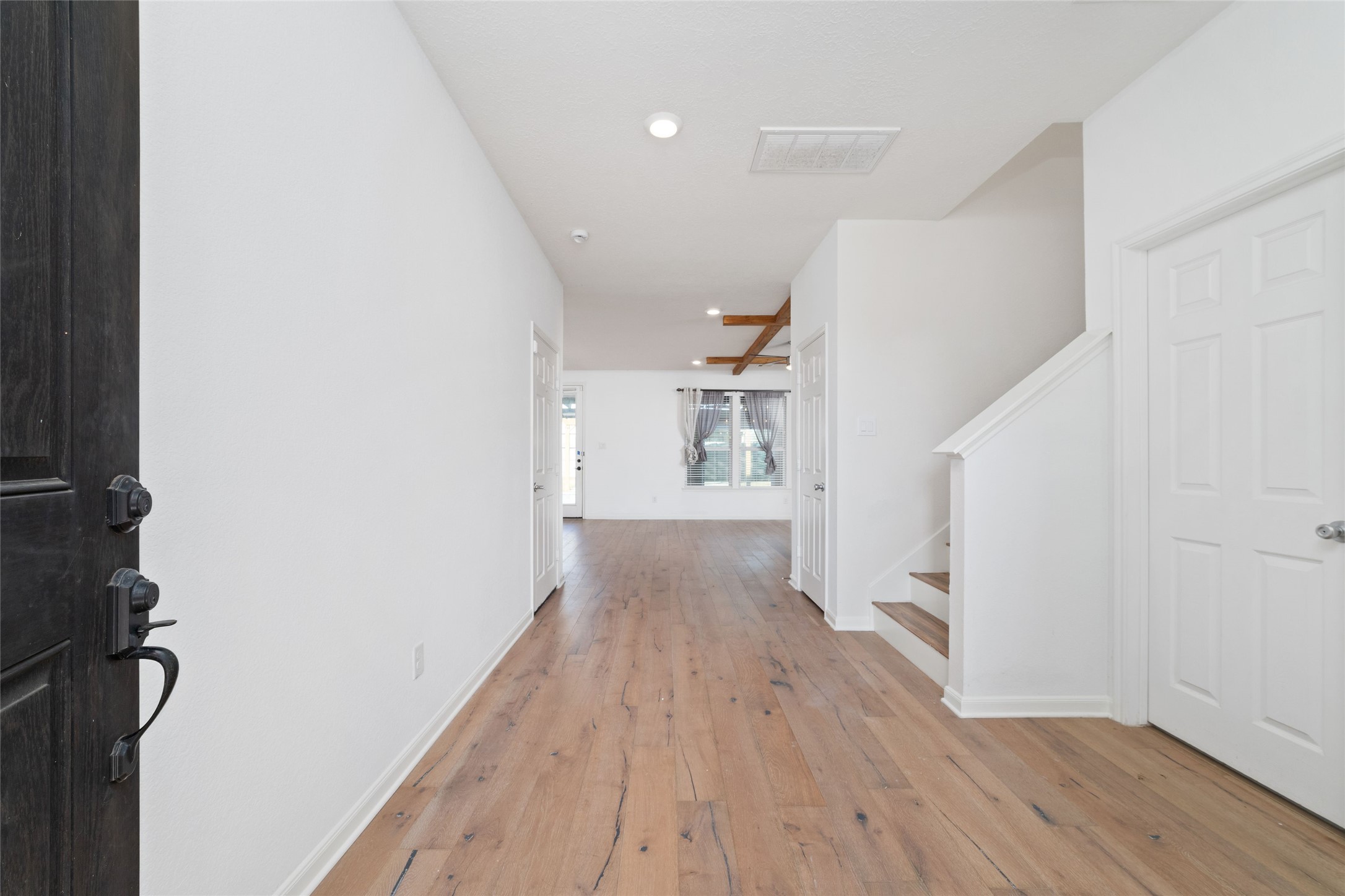 3508 Saxton Green Road Pearland, TX 77584 - Photo 4 of 45 a view of a hallway with wooden floor