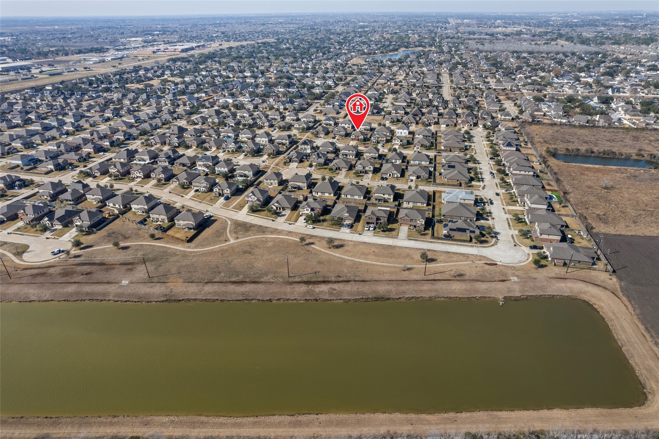 3508 Saxton Green Road Pearland, TX 77584 - Photo 43 of 45 an aerial view of a house with a lake view