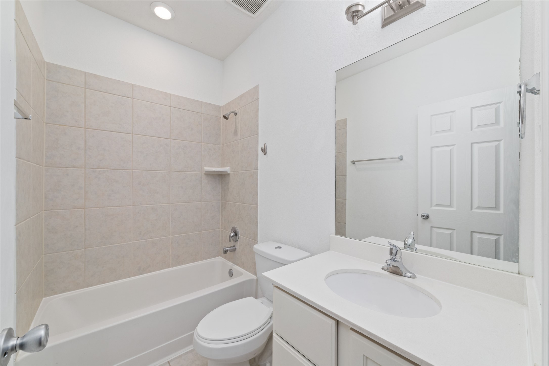 3508 Saxton Green Road Pearland, TX 77584 - Photo 7 of 45 a bathroom with a bathtub shower sink vanity mirror and toilet