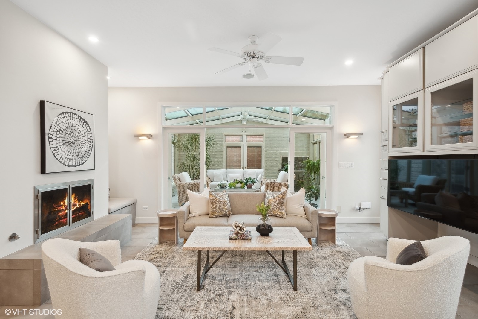 1261 West Flournoy Street Chicago, IL 60607 - Photo 12 of 43 a living room with furniture a large window and a fireplace