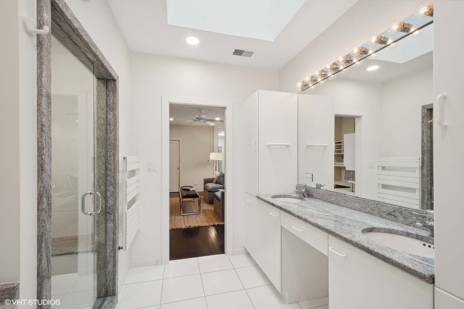 1261 West Flournoy Street Chicago, IL 60607 - Photo 29 of 43 a bathroom with a granite countertop sink mirror and shower