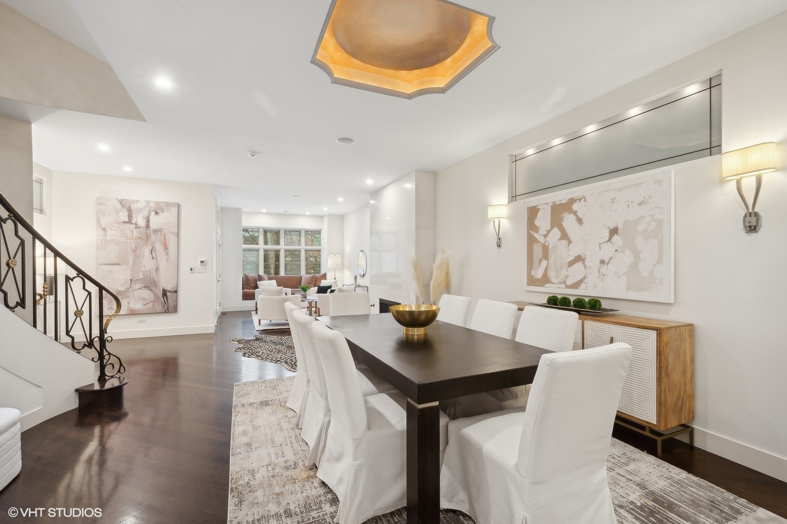 1261 West Flournoy Street Chicago, IL 60607 - Photo 3 of 43 a view of a dining room and livingroom with furniture a rug a potted plant and a chandelier