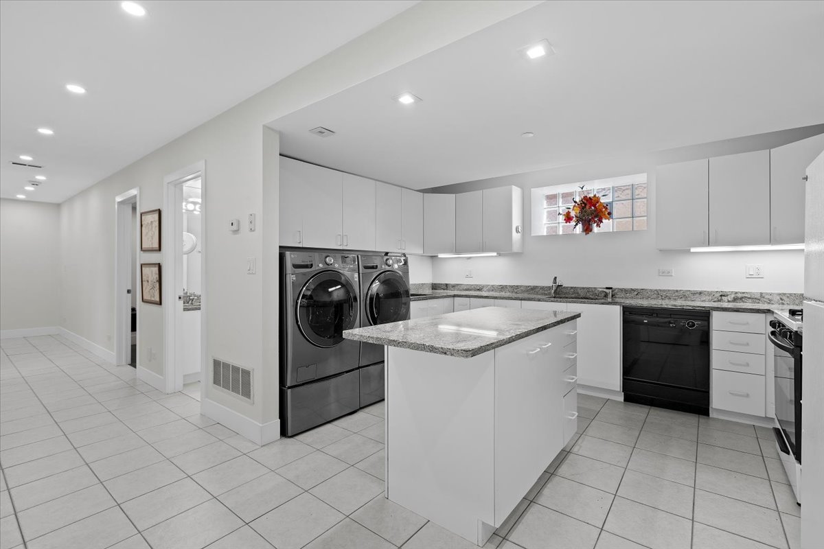 1261 West Flournoy Street Chicago, IL 60607 - Photo 34 of 43 a kitchen with a sink stove and cabinets