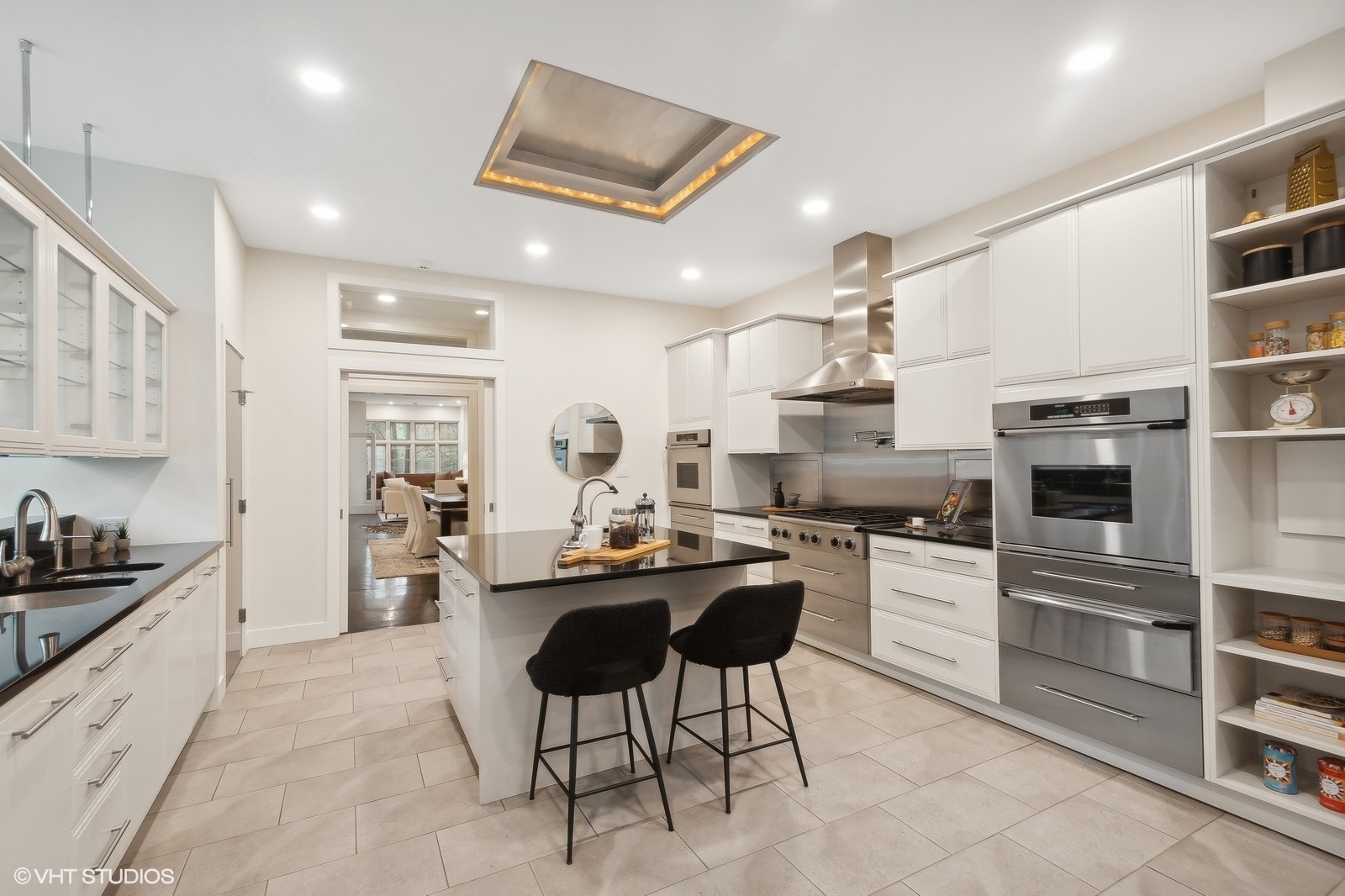 1261 West Flournoy Street Chicago, IL 60607 - Photo 9 of 43 a kitchen with cabinets and chairs