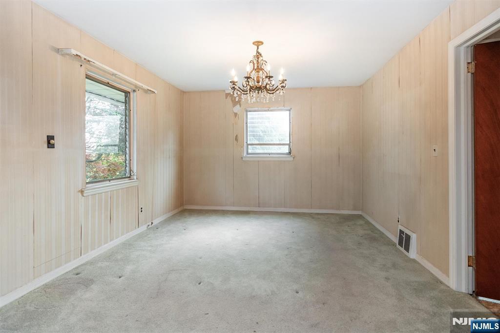 66 Coeyman Avenue Bloomfield, NJ 07003 - Photo 12 of 29 an empty room that has a window
